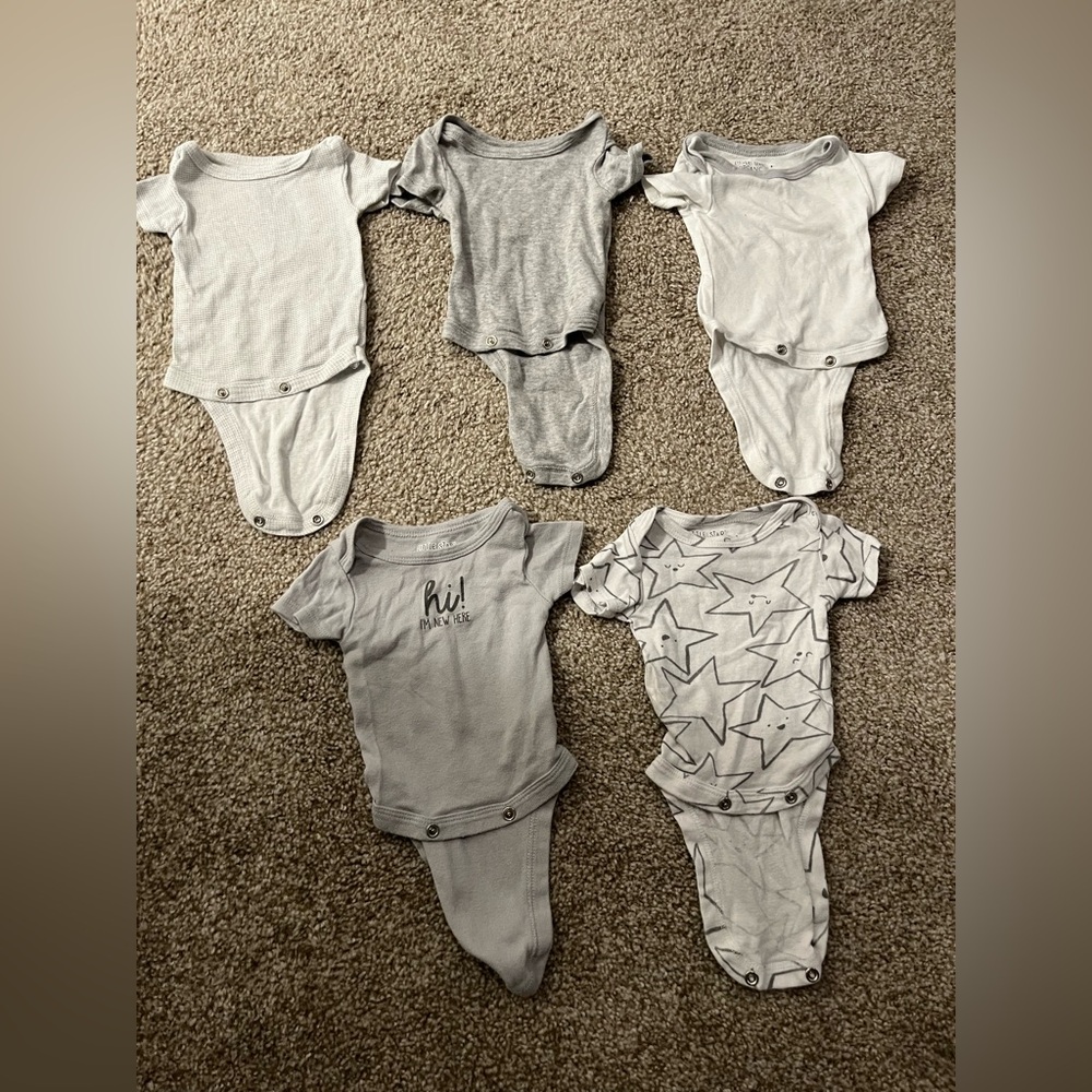 Assorted newborn onesies